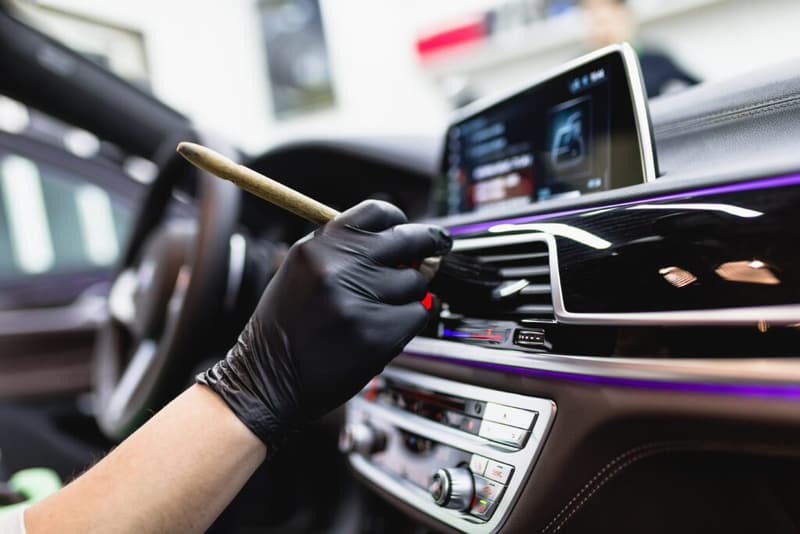 True Wash detailer working on a car interior