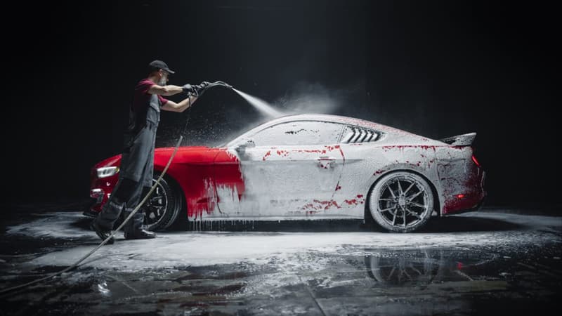 True Wash detailer washing a car in Miami