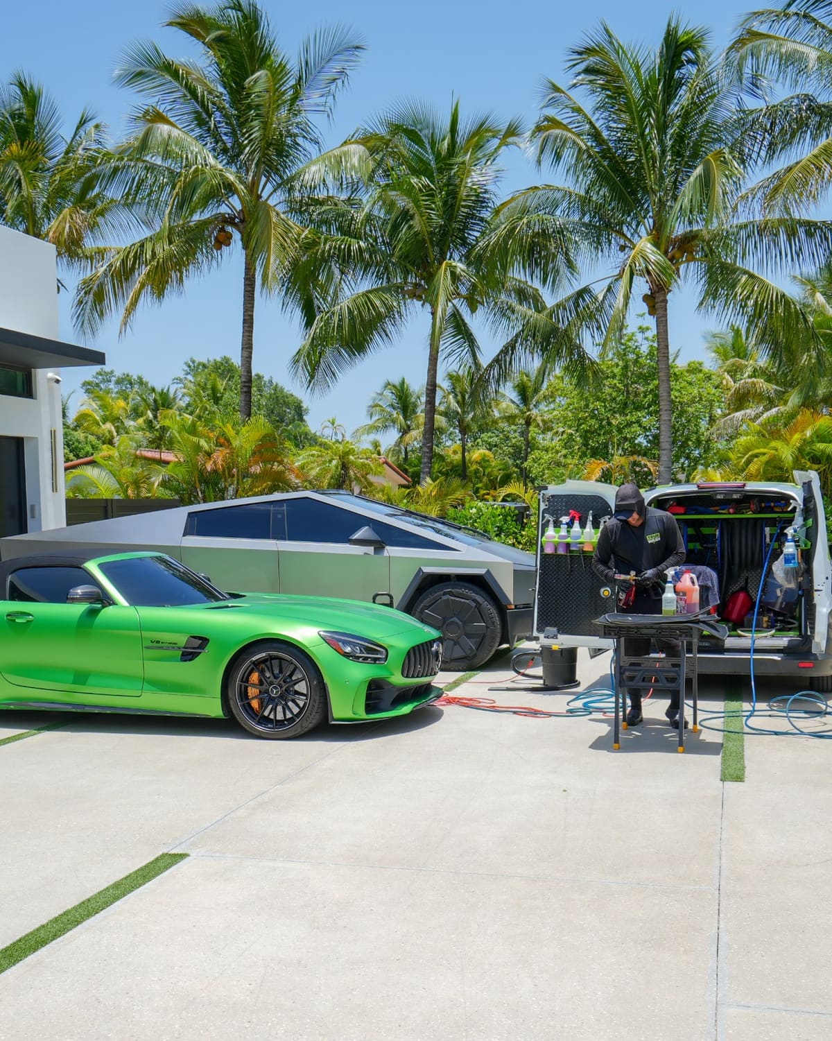 True Wash mobile detailing van and full setup at a Miami home