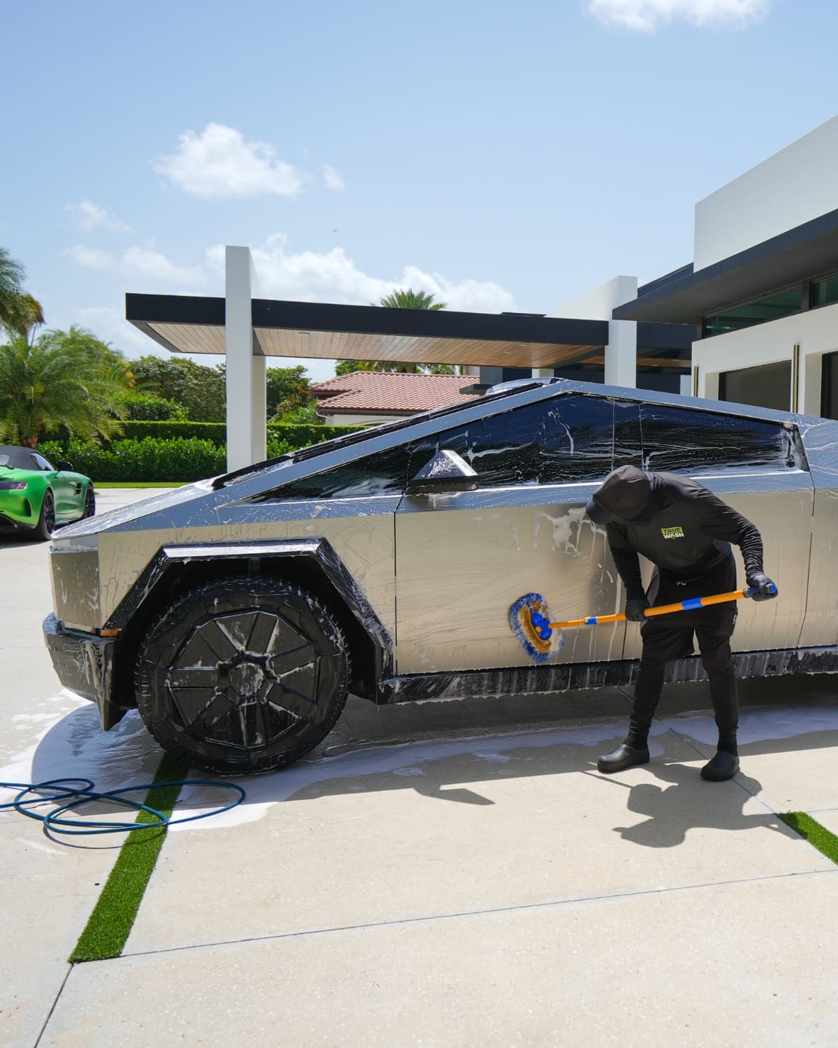 Tesla Cybertruck being hand washed by a True Wash detailer
